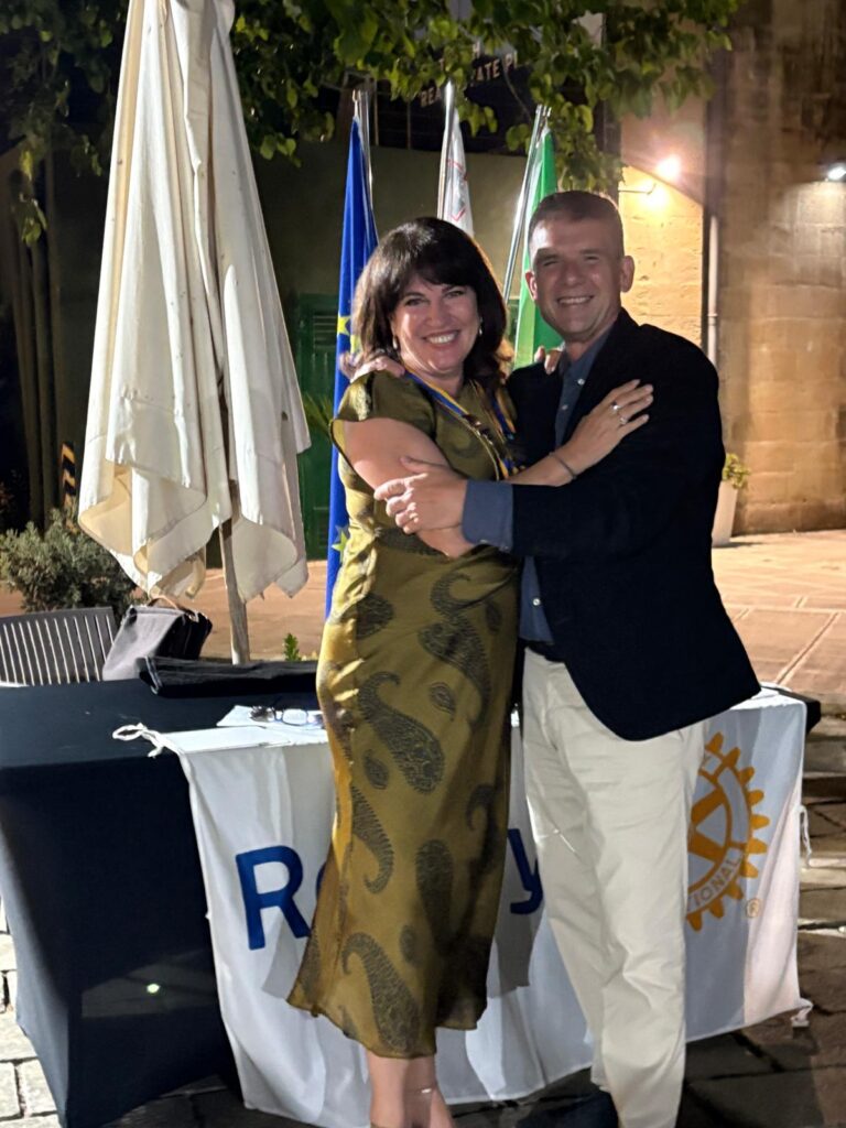 President Godfrey Swain passes the collar to the New President, Clare Vassallo.