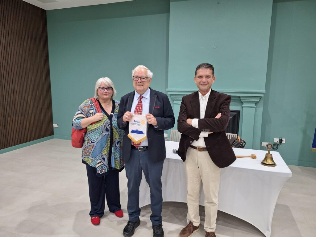 Profs Rubenstein flanked by Rtn.Gaby Doublesin and President Godfrey Swain