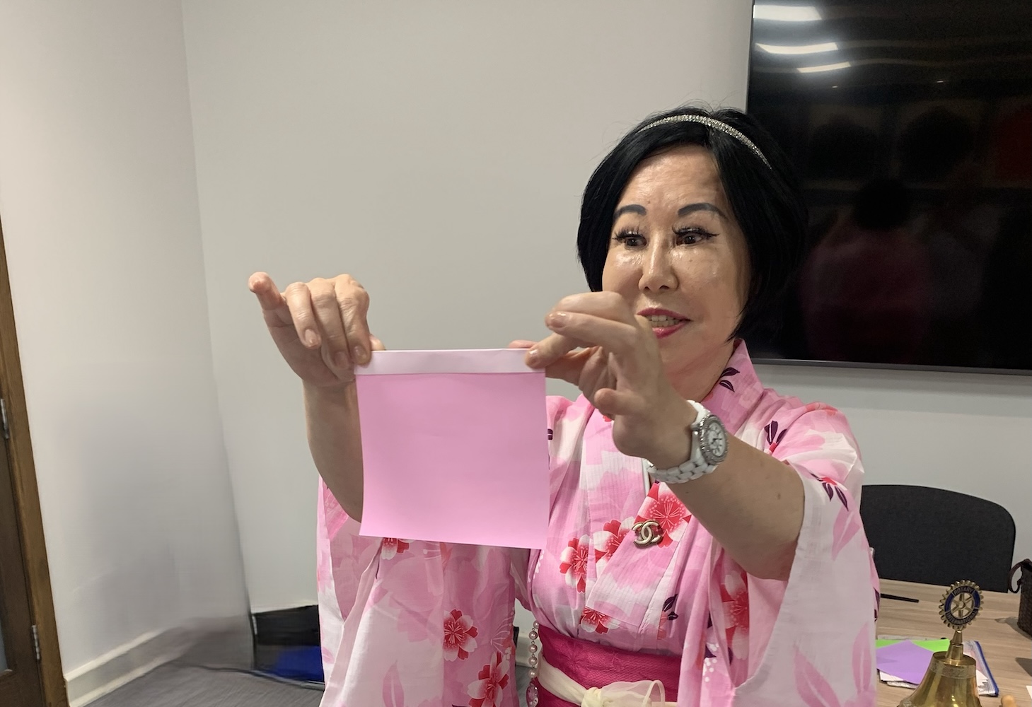 Rtn Juli explaining the Japanese art of Origami